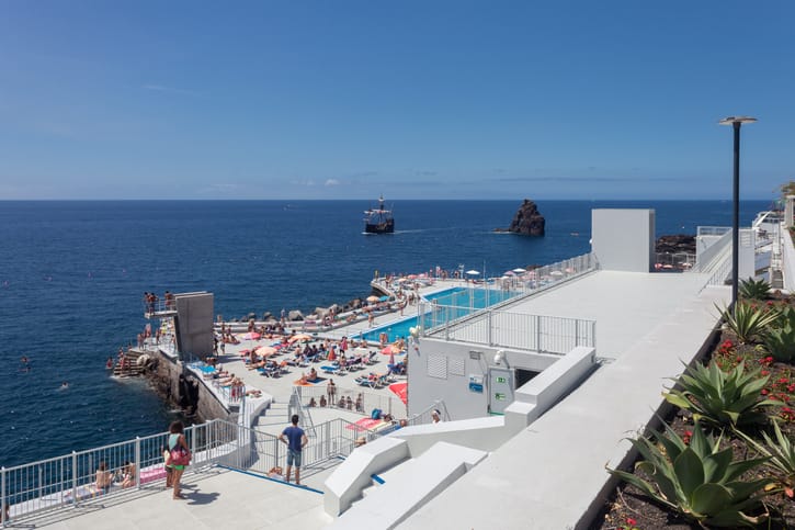 A large turquoise resort pool, illustrative of a crystal lagoon